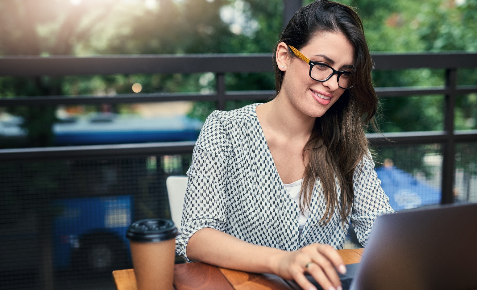 brunette woman working at laptop_GettyImages-918555706